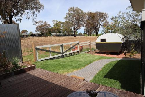 a backyard with a fence and a trailer at Sunny Vale in McLaren Vale
