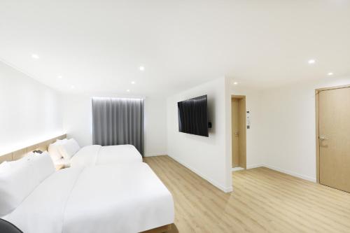Ένα ή περισσότερα κρεβάτια σε δωμάτιο στο BrownDot Hotel Hongseong Naepo