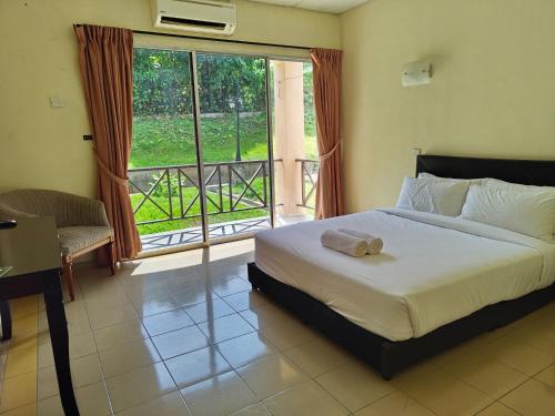 Ένα ή περισσότερα κρεβάτια σε δωμάτιο στο USAS Resort, Kuala Kangsar