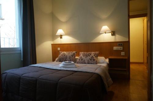 Postel nebo postele na pokoji v ubytování Hotel Elizondo