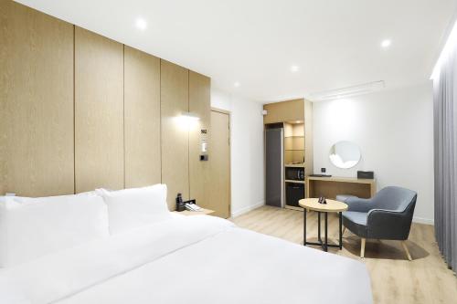Ένα ή περισσότερα κρεβάτια σε δωμάτιο στο BrownDot Hotel Hongseong Naepo