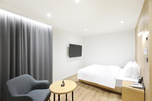 Ένα ή περισσότερα κρεβάτια σε δωμάτιο στο BrownDot Hotel Hongseong Naepo