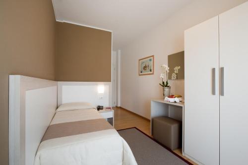 Кровать или кровати в номере Hotel Canarie