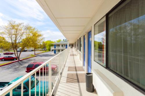 a balcony with a view of a parking lot at Motel 6-Klamath Falls, OR in Klamath Falls