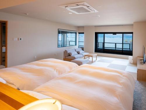 Ένα ή περισσότερα κρεβάτια σε δωμάτιο στο Suhaku