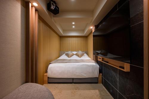 Ein Bett oder Betten in einem Zimmer der Unterkunft HOTELみなと-Minato- 麻布十番