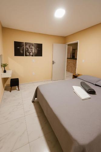 a bedroom with a large bed in a room at Apartamento inteiro Pé No Forró in Petrolina