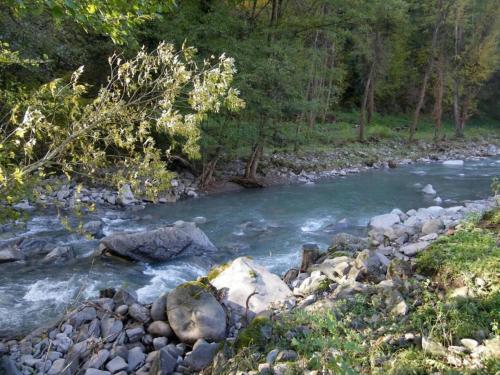 a stream of water with rocks and trees at Holiday Home in Mulazzo near Tuscan Castles in Mulazzo