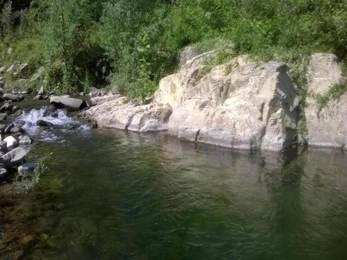 a river with some rocks and some water at Holiday Home in Mulazzo near Tuscan Castles in Mulazzo