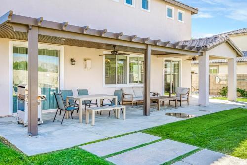 a pavilion with tables and chairs on a patio at Beautiful 5 BR house Huge Pool SPA BBQ in Indio in Indio