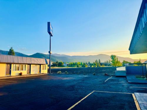an empty parking lot in front of a building at Relax Inn At Ashland in Ashland