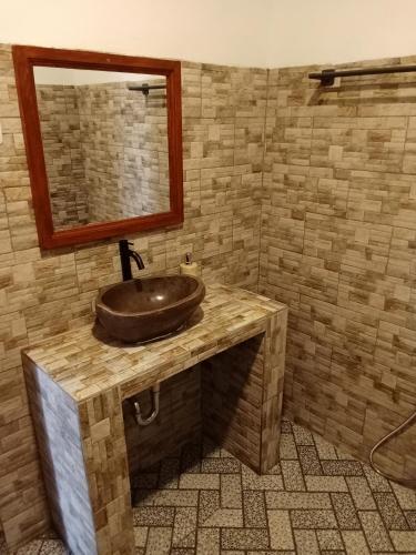 a bathroom with a sink and a mirror at Scuba Tribe Bali dive-resort in Tulamben