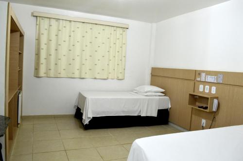 מיטה או מיטות בחדר ב-Richard Hotel