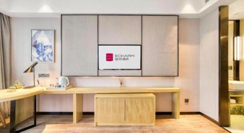 an office with a desk with at Echarm Hotel Jingjiang Bus Passenger Station Fanggu Street in Jingjiang