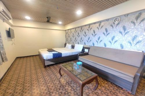 Ένα ή περισσότερα κρεβάτια σε δωμάτιο στο Harmony Inn
