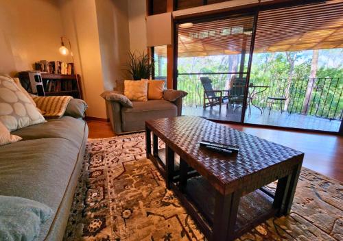 a living room with a couch and a coffee table at Sapphire Villa 535, Kingfisher Bay Resort, K'gari in K'gari Island (Fraser Island)