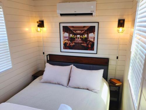 a bedroom with a bed in a small room at La Rioja Station Patio 1br Wine Escape in Fredericksburg