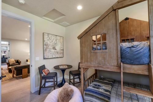 a room with two bunk beds and a living room at Violet Retreat in McCall