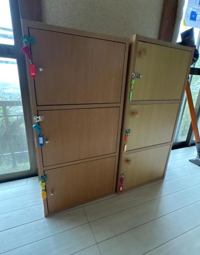 two brown cabinets sitting next to each other at 高野山ゲストハウス ラフテル Koyasan Guest House Laugh Tale in Hashimoto