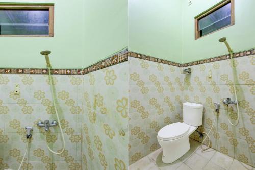 a bathroom with a toilet and a shower at Hotel O Yogyakarta near Taman Sari formerly Widitya Inn in Yogyakarta