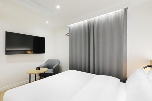 Ένα ή περισσότερα κρεβάτια σε δωμάτιο στο BrownDot Hotel Hongseong Naepo