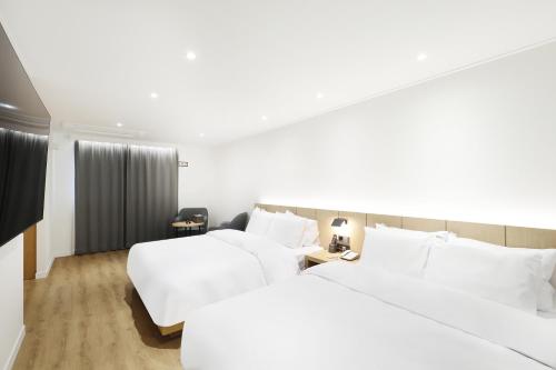 Ένα ή περισσότερα κρεβάτια σε δωμάτιο στο BrownDot Hotel Hongseong Naepo