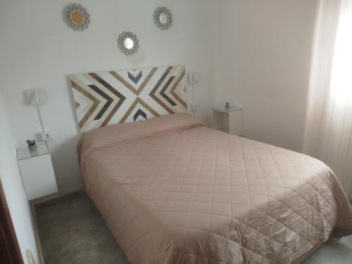 Posteľ alebo postele v izbe v ubytovaní Apartamento estudio en playa Puig