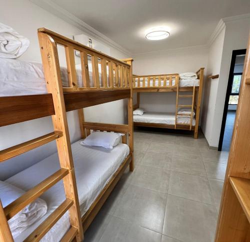 a bunk bed room with two bunk beds in it at شاليهات الكرامة in Al Muladdah