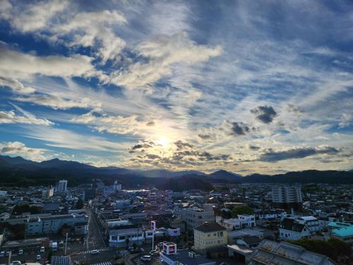 a view of a city with a cloudy sky at Hotel Socia in Hita