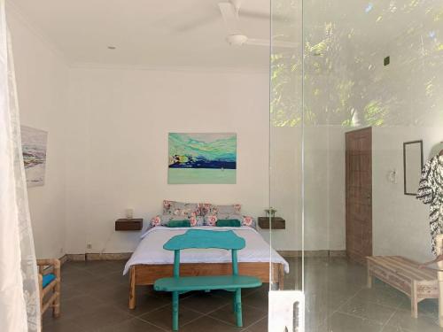 a bedroom with a bed and a glass wall at Skylodge B&B - Bali Jungle Retreat with Fine Dining & Eco Pool in Bukti