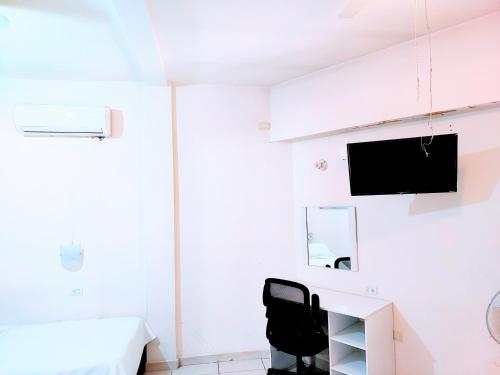 Μια τηλεόραση ή/και κέντρο ψυχαγωγίας στο Apartamento 12 con dos camas , a 200 mts del vado del rio , cerca del centro de gobierno , internet de alta velocidad