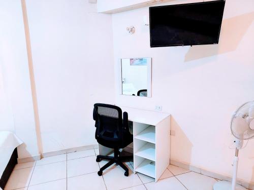 Μια τηλεόραση ή/και κέντρο ψυχαγωγίας στο Apartamento 12 con dos camas , a 200 mts del vado del rio , cerca del centro de gobierno , internet de alta velocidad