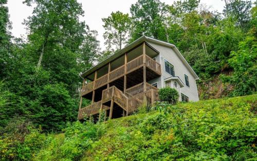 a house on top of a hill with trees at Among The Clouds 2240 in Gatlinburg