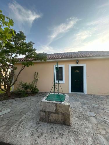 a building with a sign in front of it at Anabelis studios & apartments in Katelios
