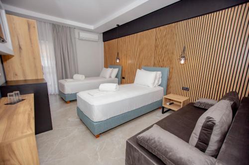 Ένα ή περισσότερα κρεβάτια σε δωμάτιο στο Konstantinoupolis Rooms