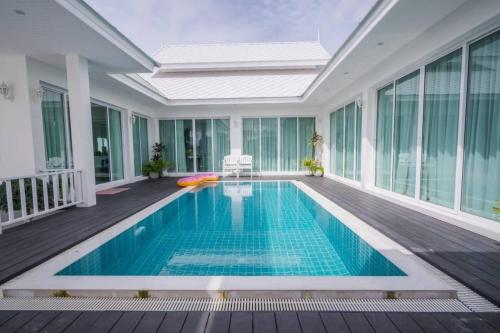 a swimming pool in the middle of a house at มาวิน 11 in Hua Hin