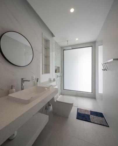 a bathroom with a sink and a toilet and a mirror at Silk Villa - 3 Bedrooms - Pool - Central Area in Bophut