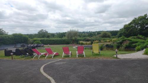 a group of chairs sitting on the side of a road at Gîte Chez Gwen et Flo avec Jardin in Cholet