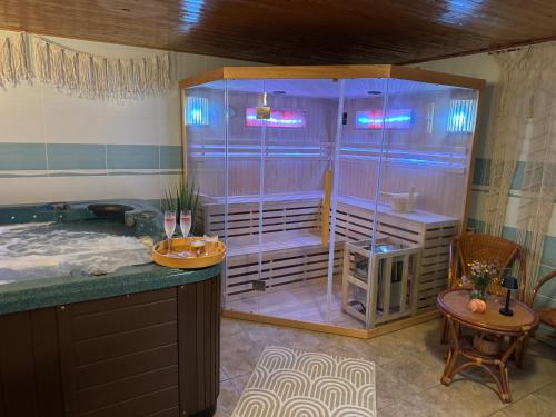 a large bathroom with a tub and a shower at Bílá Labuť Pec in Pec pod Sněžkou