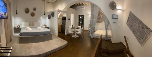 a bedroom with a bed and a sink in a room at Rhodes Old Town Harmony Suite in Rhodes Town