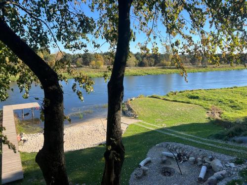 a view of a river from a tree at Relax nad Narwią u Oli I Pawła in Pultusk