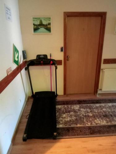 a room with a door and a luggage cart at Stary Drahim in Czaplinek