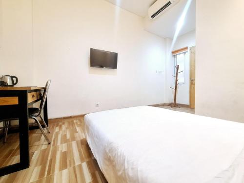 Μια τηλεόραση ή/και κέντρο ψυχαγωγίας στο Sari Panguripan RedPartner Near UGM