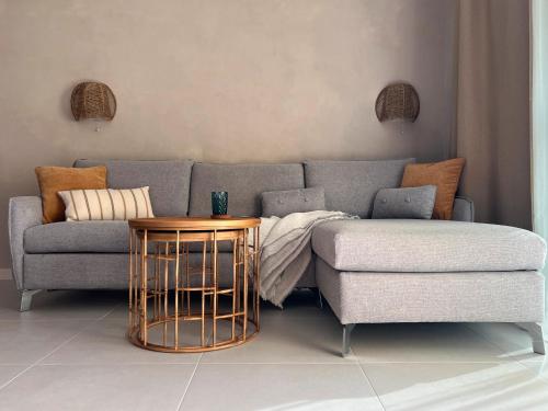 a living room with a couch and a table at Fuerte Casa 66 in Costa Calma