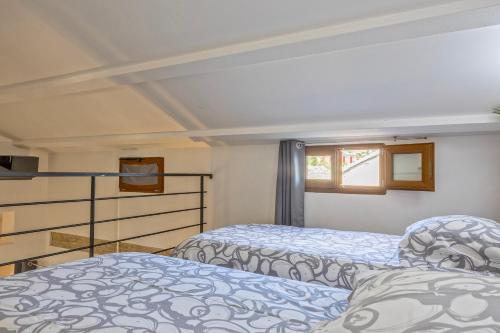 Postel nebo postele na pokoji v ubytování Appartement 4 pers tout confort au Coeur du village d Erbalunga Parking gratuit à 100 m