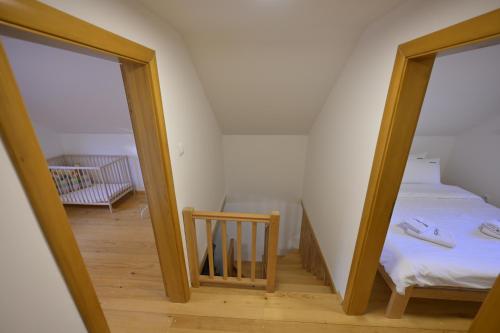 a room with two mirrors and a bed in it at Vila Fruškica in Vrdnik