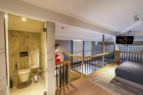 a bathroom with a shower and a toilet in a room at Broyt Hotel in Istanbul