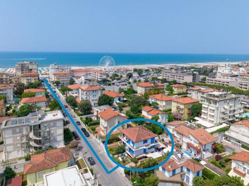 an aerial view of a city with buildings and the ocean at Villa Versilia in Lido di Camaiore