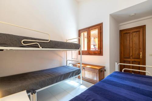 Ένα ή περισσότερα κρεβάτια σε δωμάτιο στο Villino Rifugio