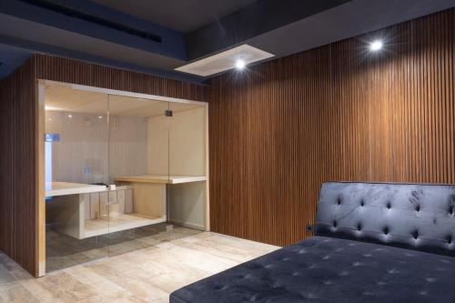 a bedroom with a bed and a closet and a counter at Villa Alba Dorata in Polignano a Mare